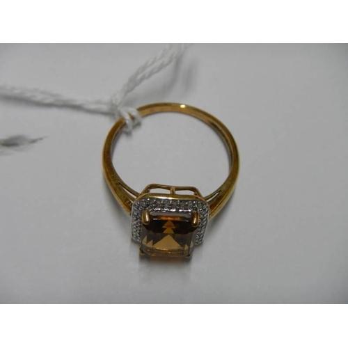 8 - A 9ct gold ring set amber coloured stone, size S half, 3.1 grams.