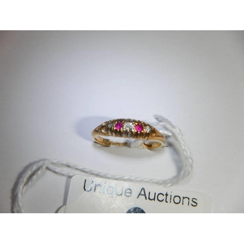 9 - An 18ct gold diamond and ruby ring, size N, 2.7 grams.