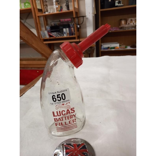 650 - A vintage Lucas glass battery filler bottle and a Great Britain car badge.