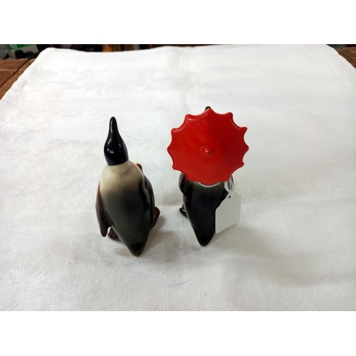 670 - Two Beswick penguins.