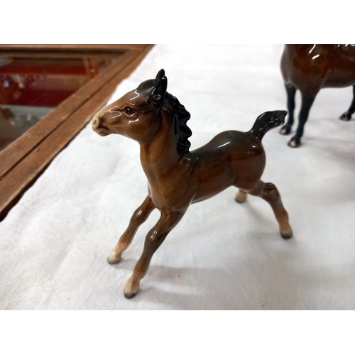 671 - Three Beswick horses.