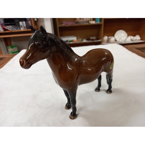 671 - Three Beswick horses.