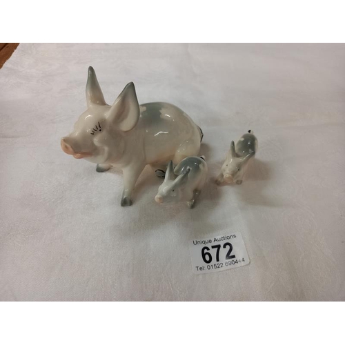 672 - Three Beswick novelty pigs.