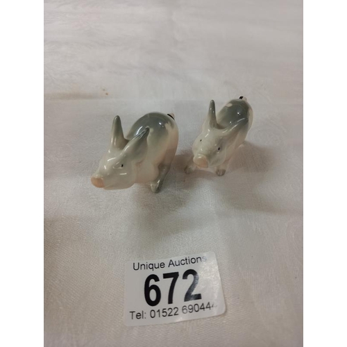 672 - Three Beswick novelty pigs.