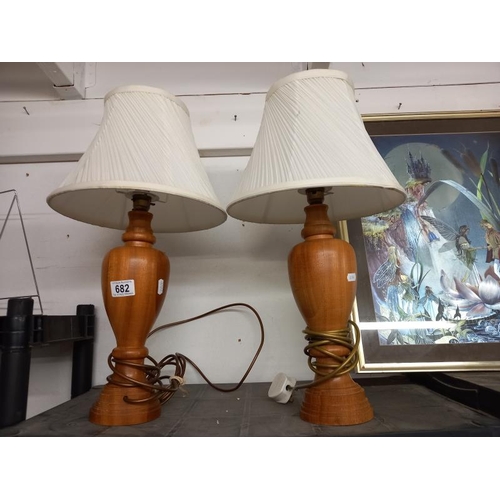 682 - A pair of tall ornate turned wood table lamps. COLLECT ONLY.