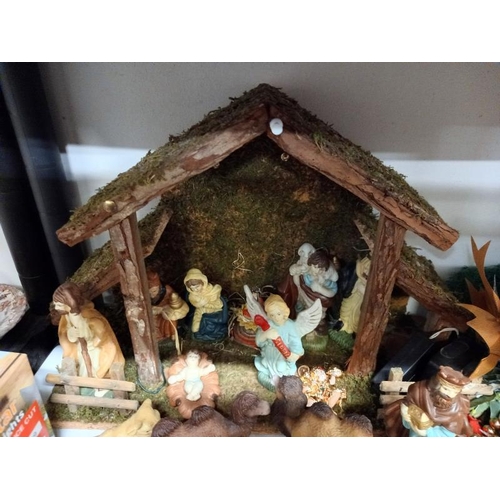686 - A shelf of Christmas decorations.