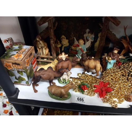 686 - A shelf of Christmas decorations.