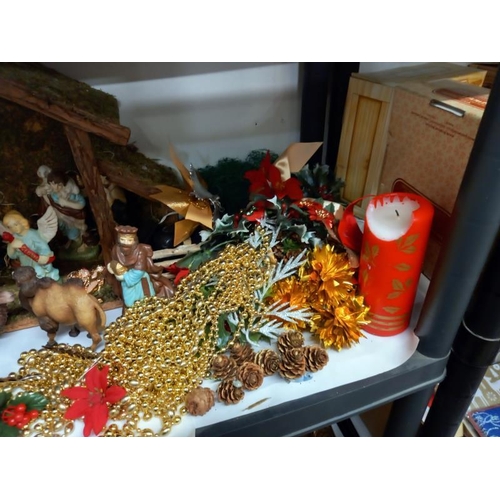686 - A shelf of Christmas decorations.