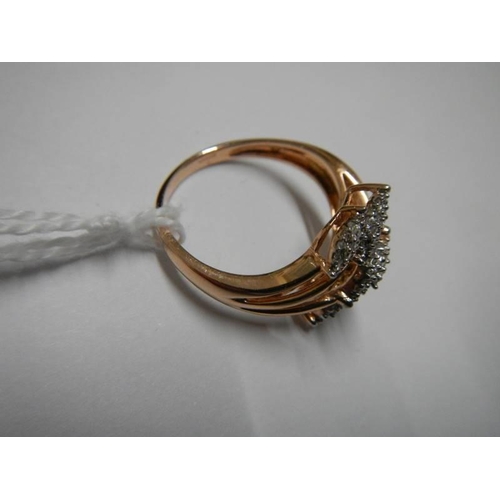 31 - A yellow gold and diamond shaped ring, size O half, 2.9 grams.