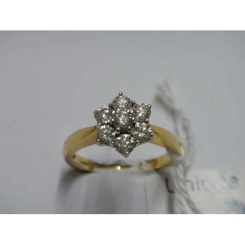 33 - An 18ct yellow gold floral diamond ring, size M, 4.4 grams.