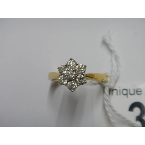 33 - An 18ct yellow gold floral diamond ring, size M, 4.4 grams.