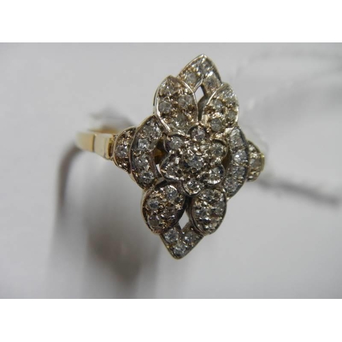 35 - A five section floral white gold and diamond ring, size N half, 5.5 grams.