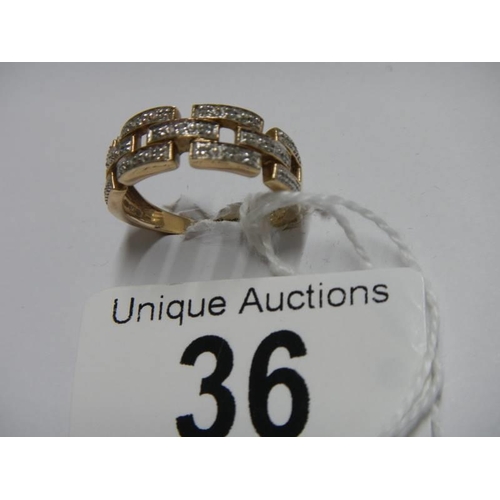 36 - A white/yellow gold Greek key pattern diamond ring, size O, 3.5 grams