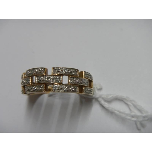 36 - A white/yellow gold Greek key pattern diamond ring, size O, 3.5 grams