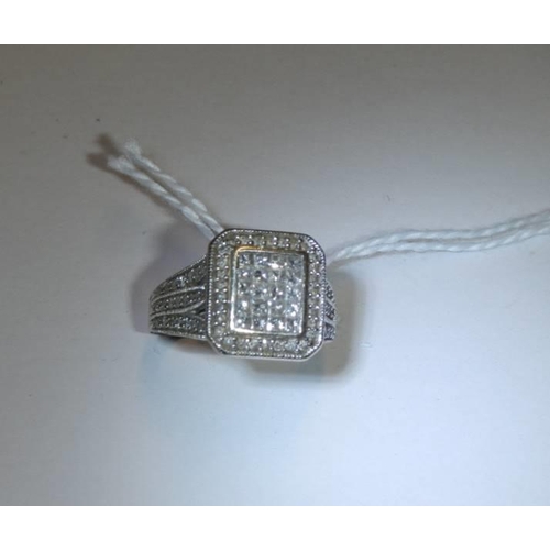 37 - A 1 ct plus square shaped diamond ring, 6.9 grams. size L.