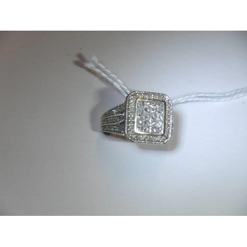 37 - A 1 ct plus square shaped diamond ring, 6.9 grams. size L.