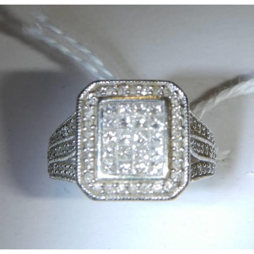 37 - A 1 ct plus square shaped diamond ring, 6.9 grams. size L.