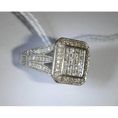 37 - A 1 ct plus square shaped diamond ring, 6.9 grams. size L.