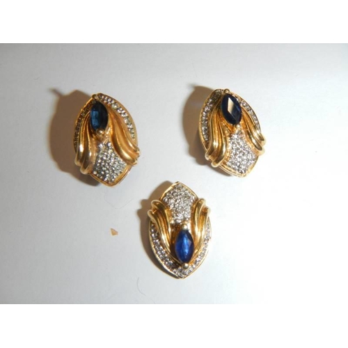 40 - An 18ct gold sapphire and diamond pendant and earring set. 7.3 grams.