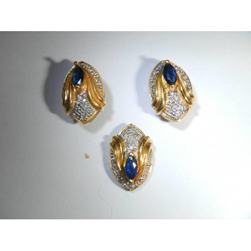 40 - An 18ct gold sapphire and diamond pendant and earring set. 7.3 grams.