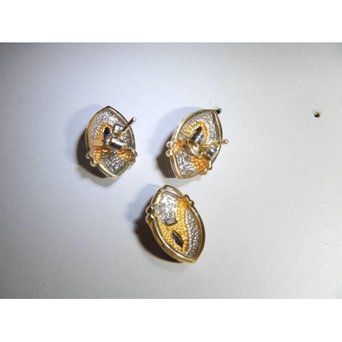 40 - An 18ct gold sapphire and diamond pendant and earring set. 7.3 grams.