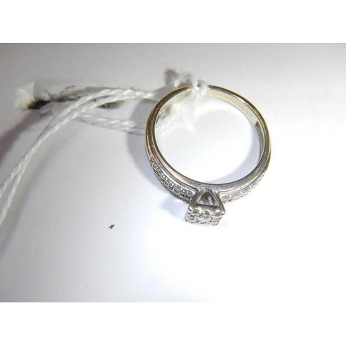 42 - A white gold square shaped diamond ring, size N, 2.7 grams