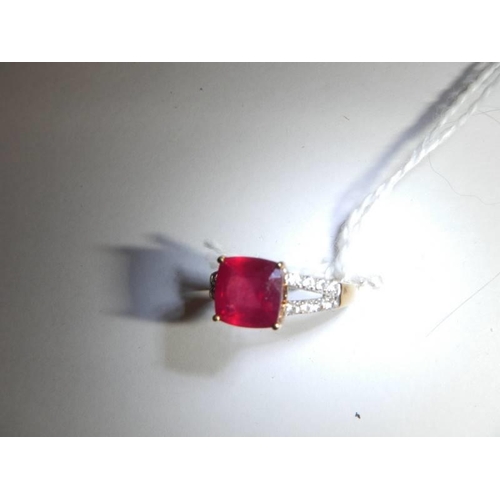 45 - A yellow gold diamond and ruby ring, size N, 2.9 grams.