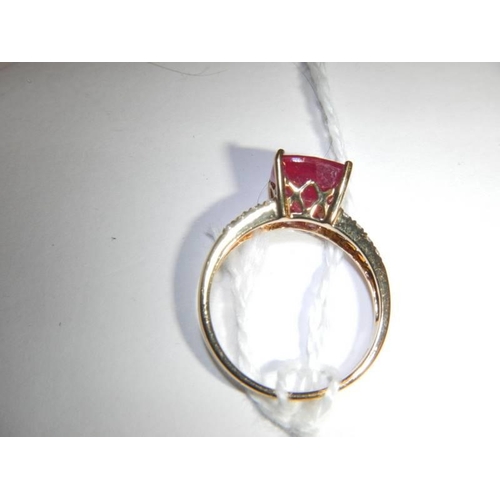 45 - A yellow gold diamond and ruby ring, size N, 2.9 grams.