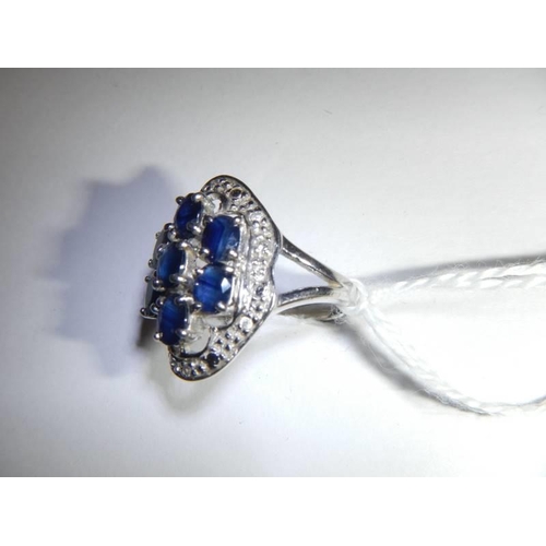 46 - A large white gold sapphire and diamond ring, size M half, 5.6 grams.