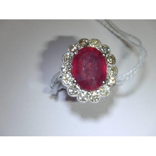 48 - A 6.5 carat oval ruby platinum and diamond ring, size N half, 8 grams.