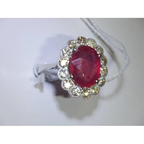 48 - A 6.5 carat oval ruby platinum and diamond ring, size N half, 8 grams.