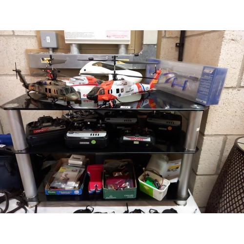 784 - A quantity of radio control helicopters & accessories