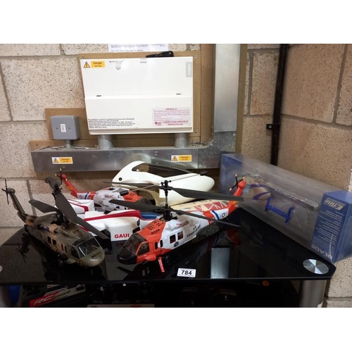 784 - A quantity of radio control helicopters & accessories