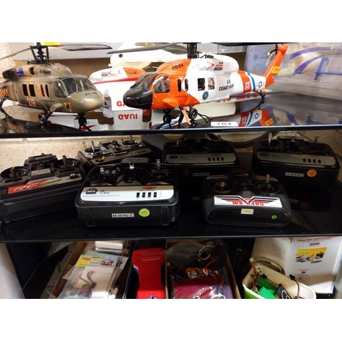 784 - A quantity of radio control helicopters & accessories