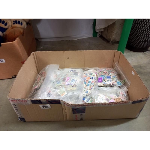 786 - A quantity of bags of loose stamps