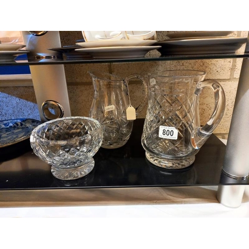 800 - Two cut glass jugs and a cut glass bowl.