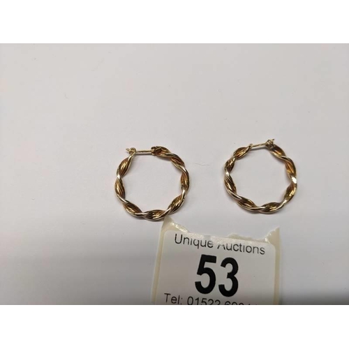 53 - A pair of 9ct gold twisted design hoop earrings, 2.3 grams.