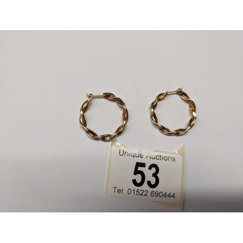 53 - A pair of 9ct gold twisted design hoop earrings, 2.3 grams.