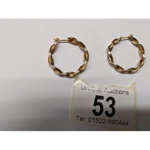 53 - A pair of 9ct gold twisted design hoop earrings, 2.3 grams.