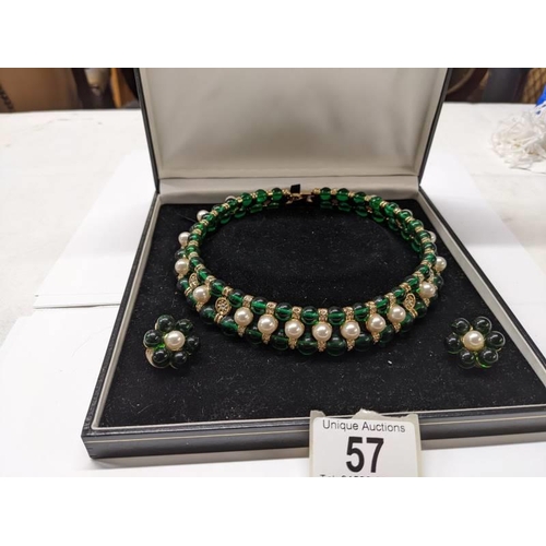 57 - A choker style green stone and pearl necklace with matching earrings.