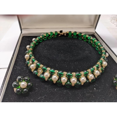 57 - A choker style green stone and pearl necklace with matching earrings.