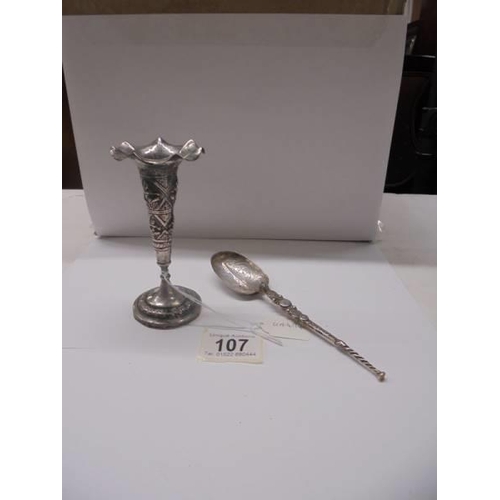 107 - An Asian silver spill vase and spoon.