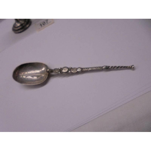 107 - An Asian silver spill vase and spoon.