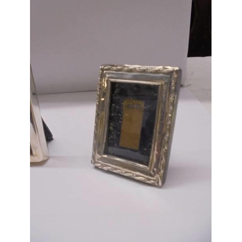 111 - Three small silver photo frames, 7 x 5 cm, 6 x 4.5 cm and 5 x 3.5 cm.