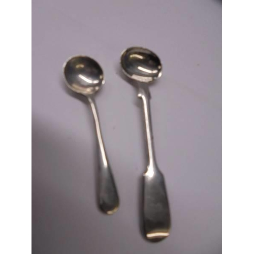 112 - A silver salt spoon, mustard spoon, bookmark and fob, 33.7 grams.