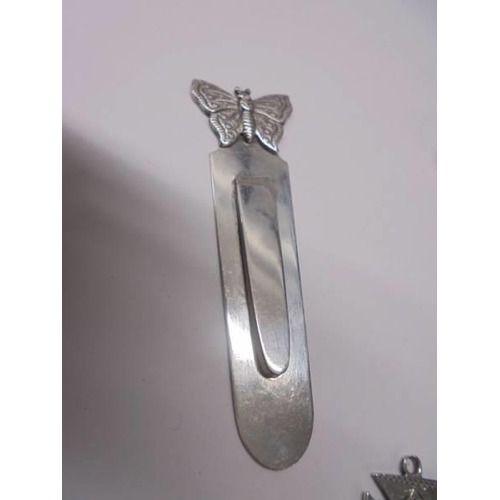 112 - A silver salt spoon, mustard spoon, bookmark and fob, 33.7 grams.