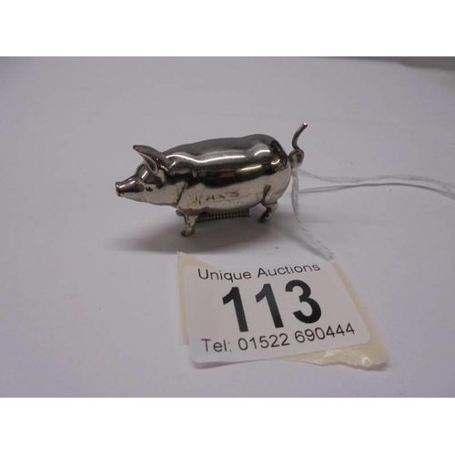 113 - An early 20th century silver plated pig needlework tape measure.