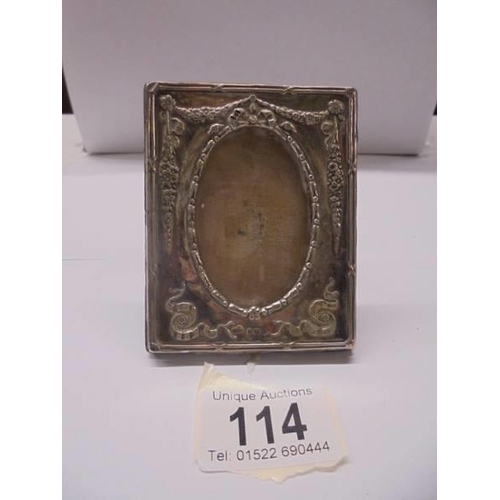 114 - An Adam style silver photo frame, 9 x 7 cm.