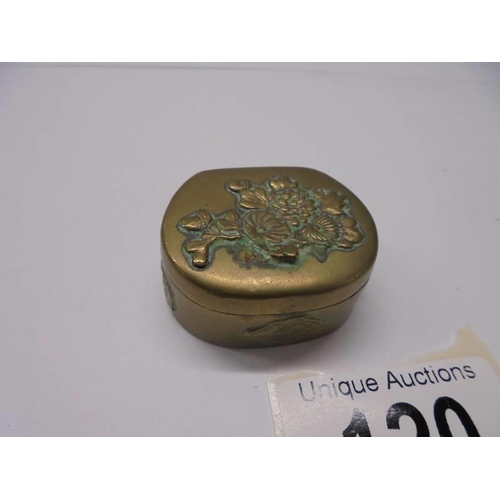 120 - Two antique embossed metal pill boxes.