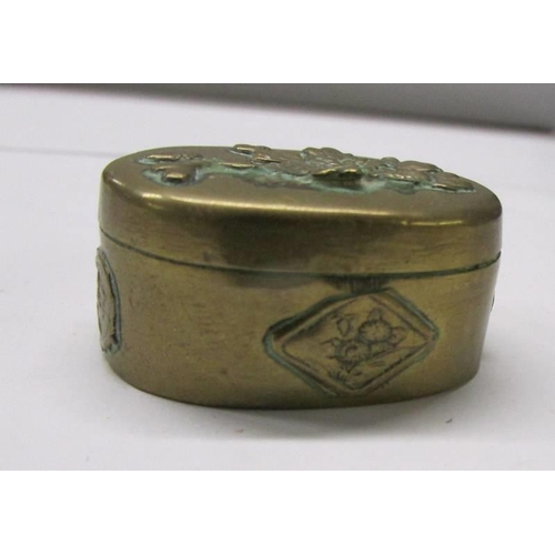 120 - Two antique embossed metal pill boxes.